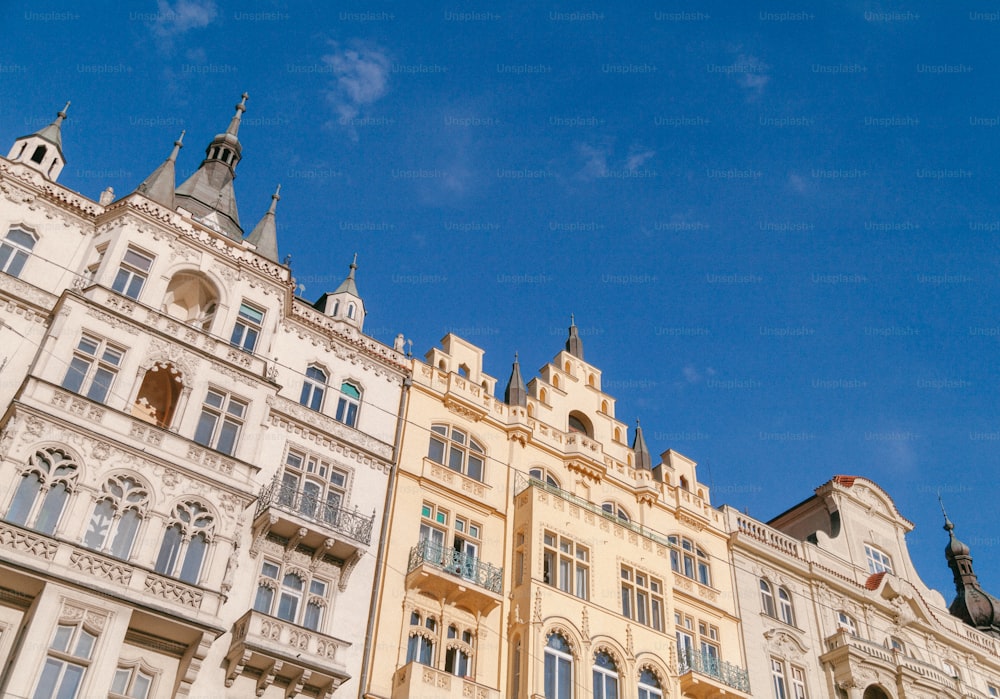 a row of buildings with a blue sky in the background