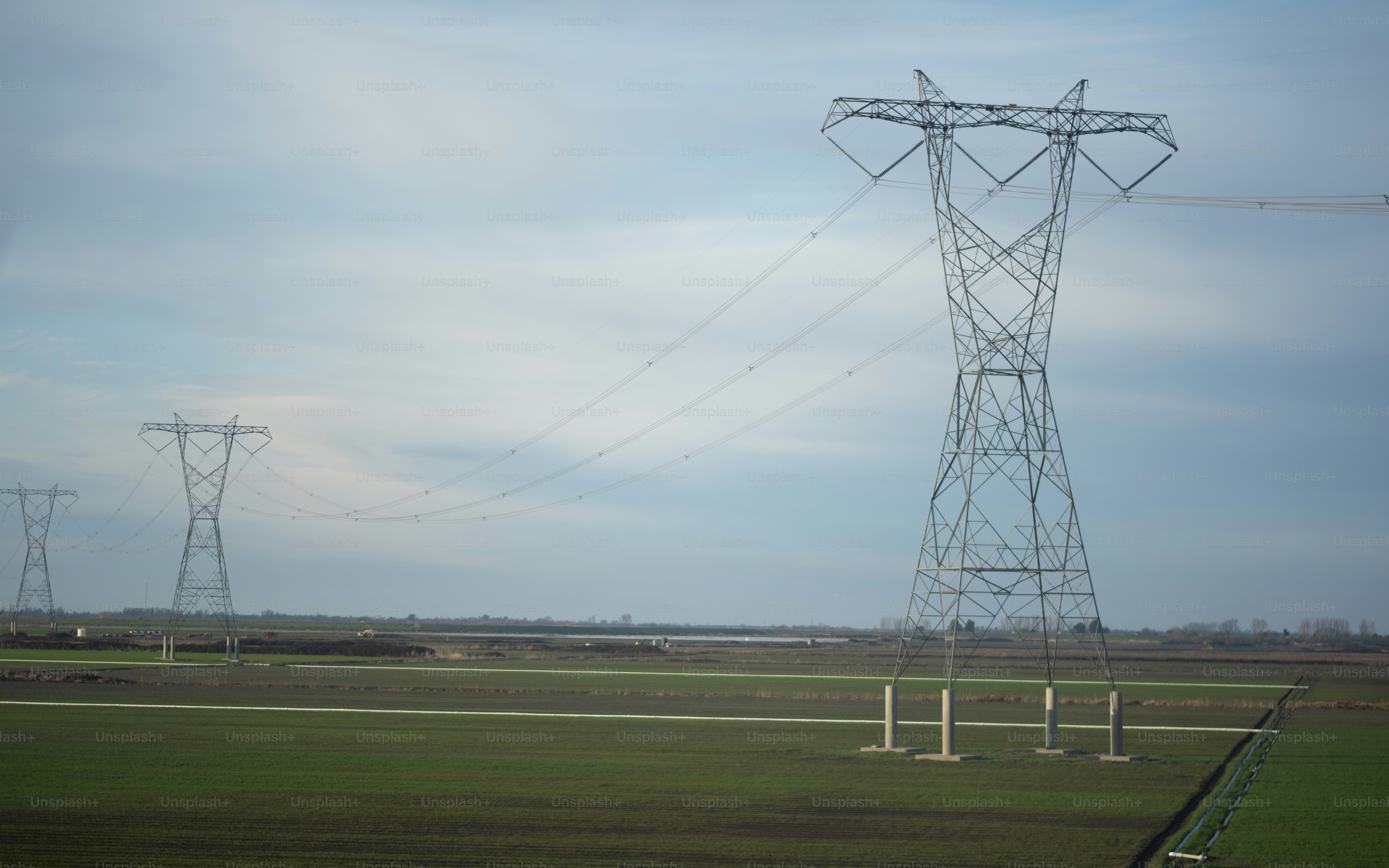 Power lines over agricultural fields.