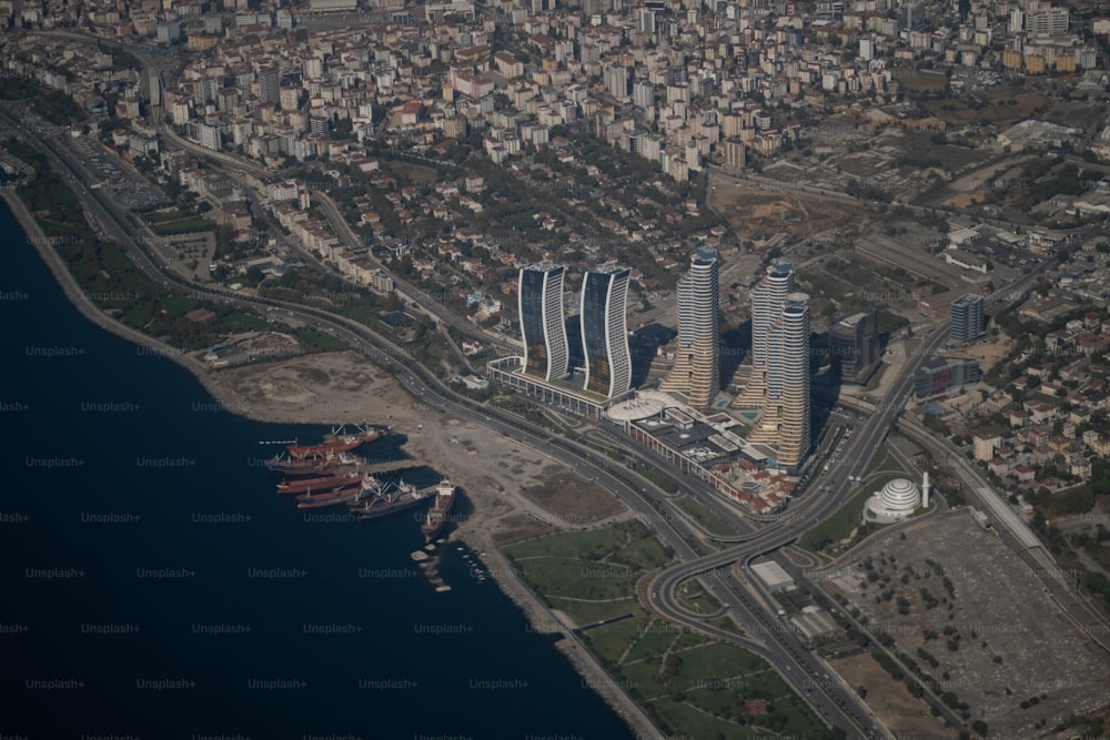 an aerial view of a city and a body of water