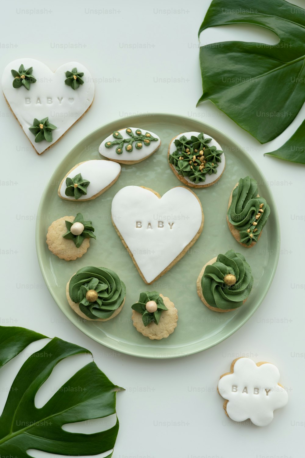 a plate with cookies and cookies decorated like a heart