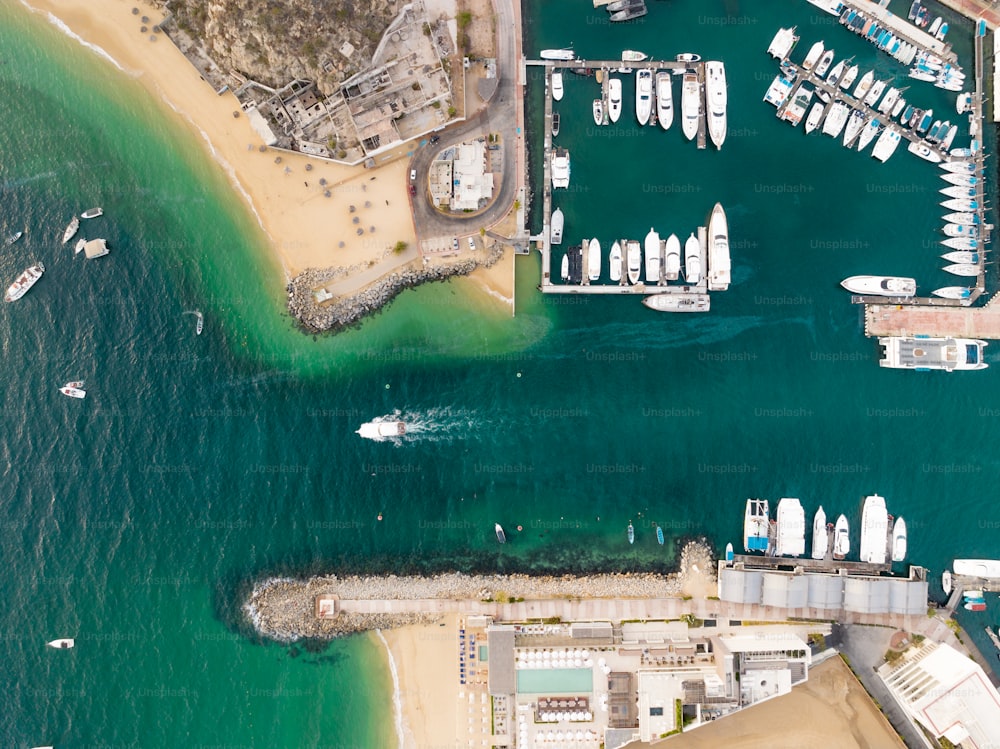 an aerial view of boats docked at a pier