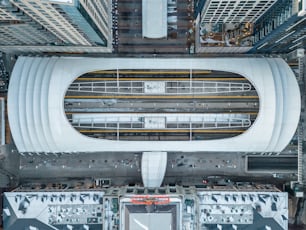 an aerial view of a train station in a city