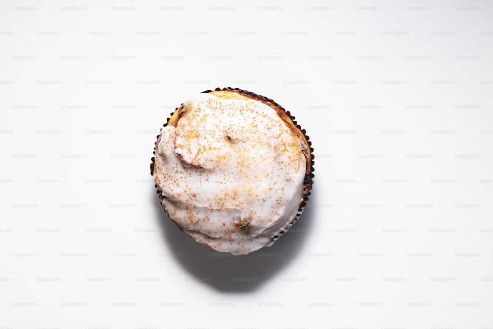 a close up of a cupcake on a white surface