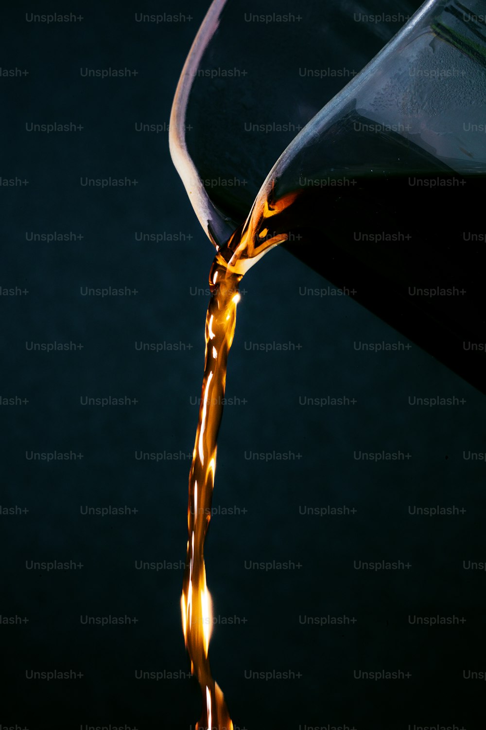a glass of liquid being poured into it