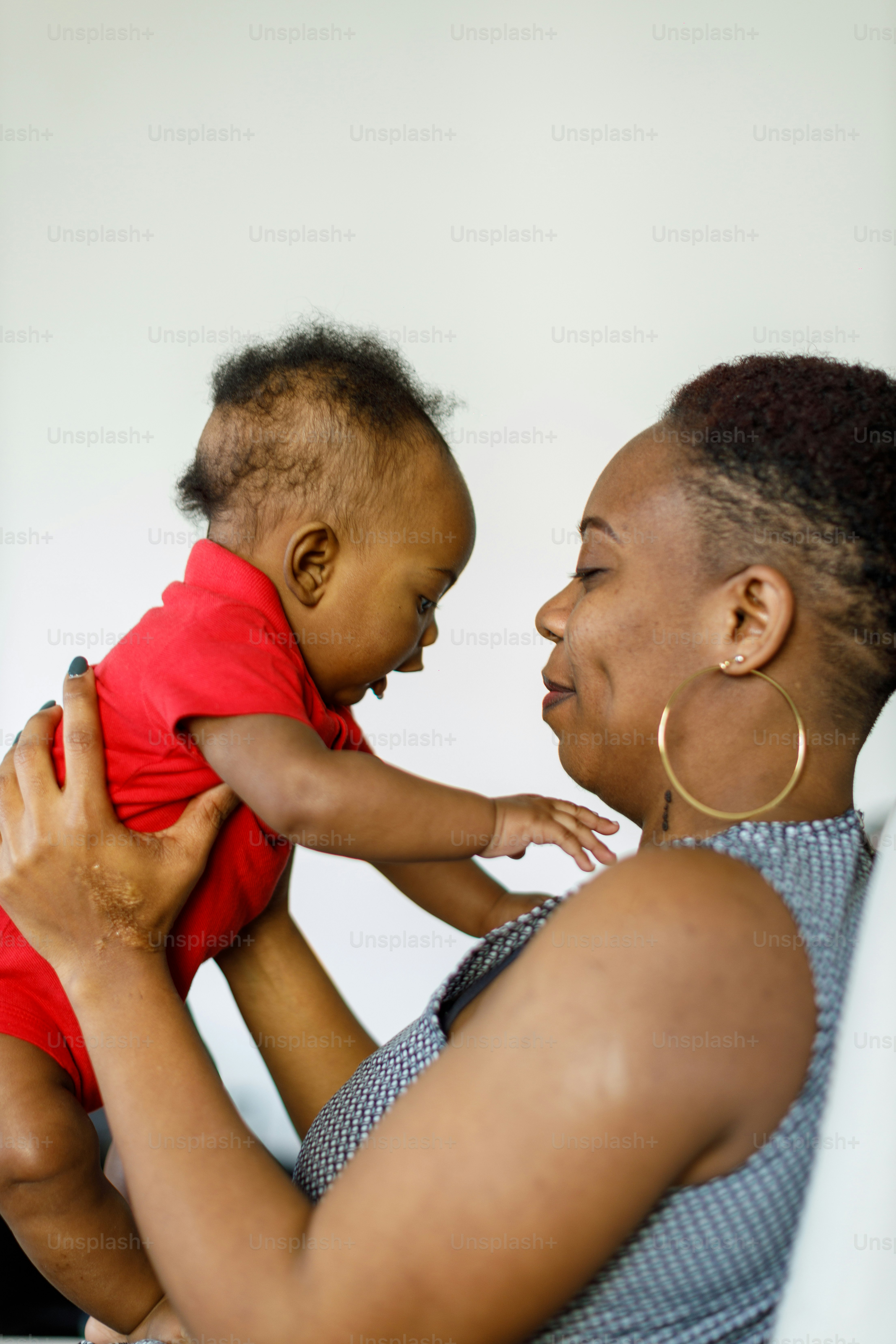 a woman holding a baby in her arms