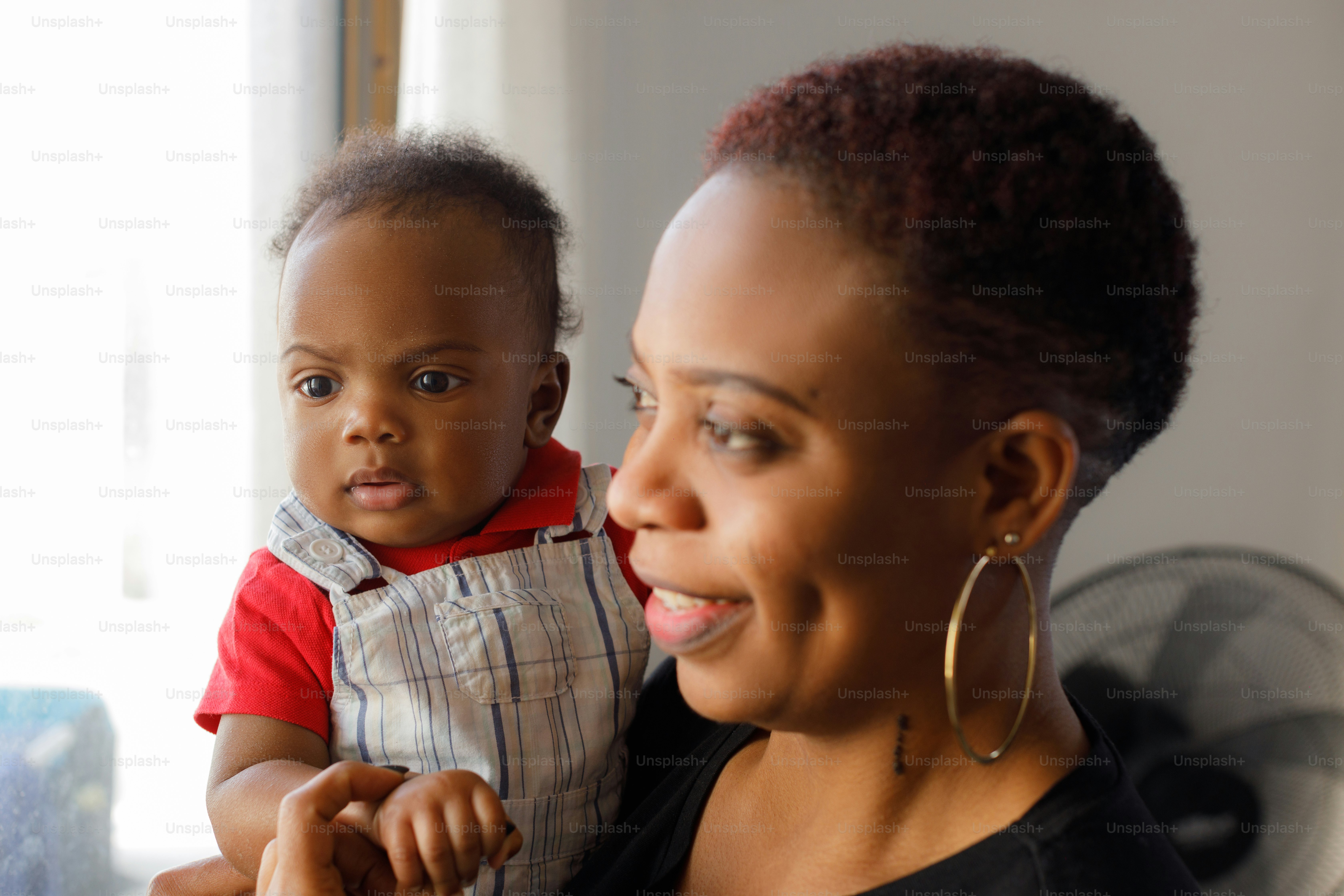 a woman holding a baby in her arms