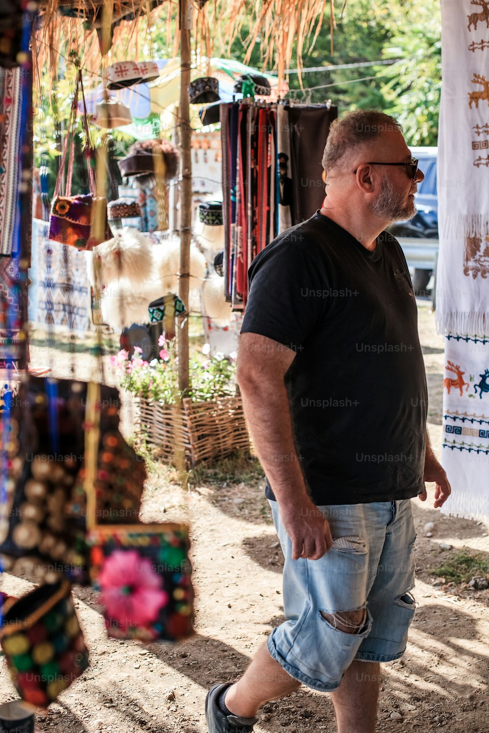 a man is walking through a market area