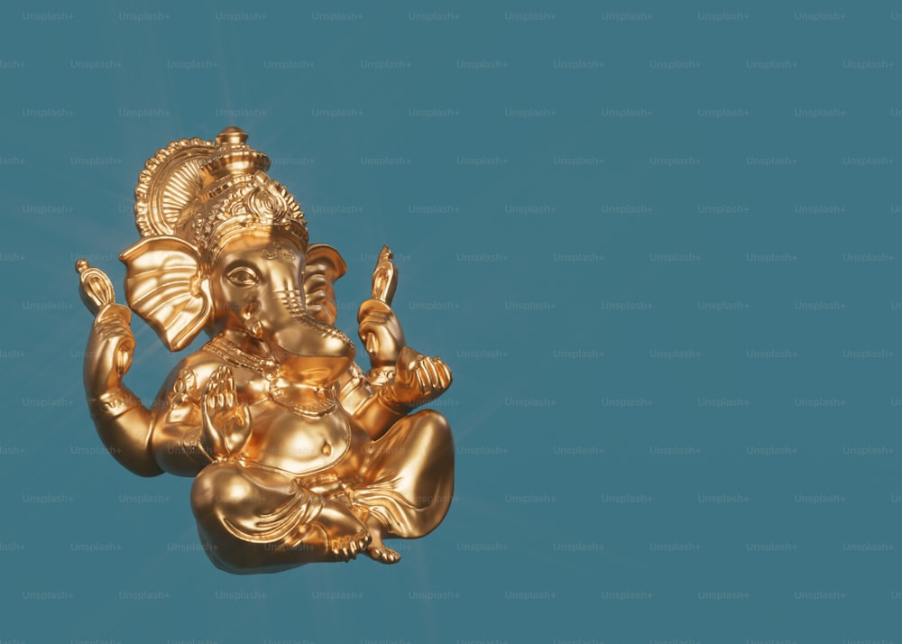 uma estátua dourada de um elefante em um fundo azul