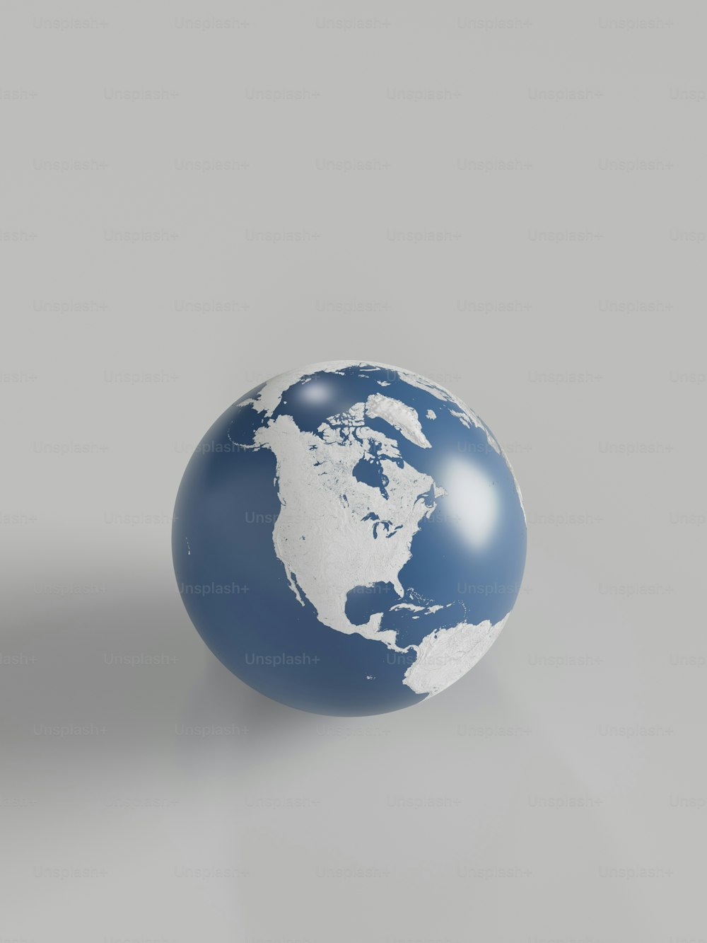 a blue and white globe sitting on top of a table