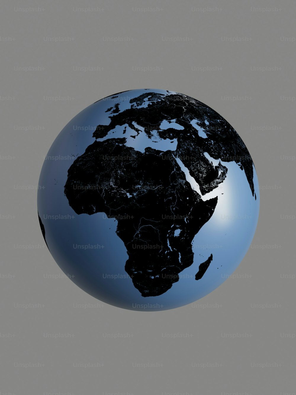 un globe bleu et noir sur fond gris