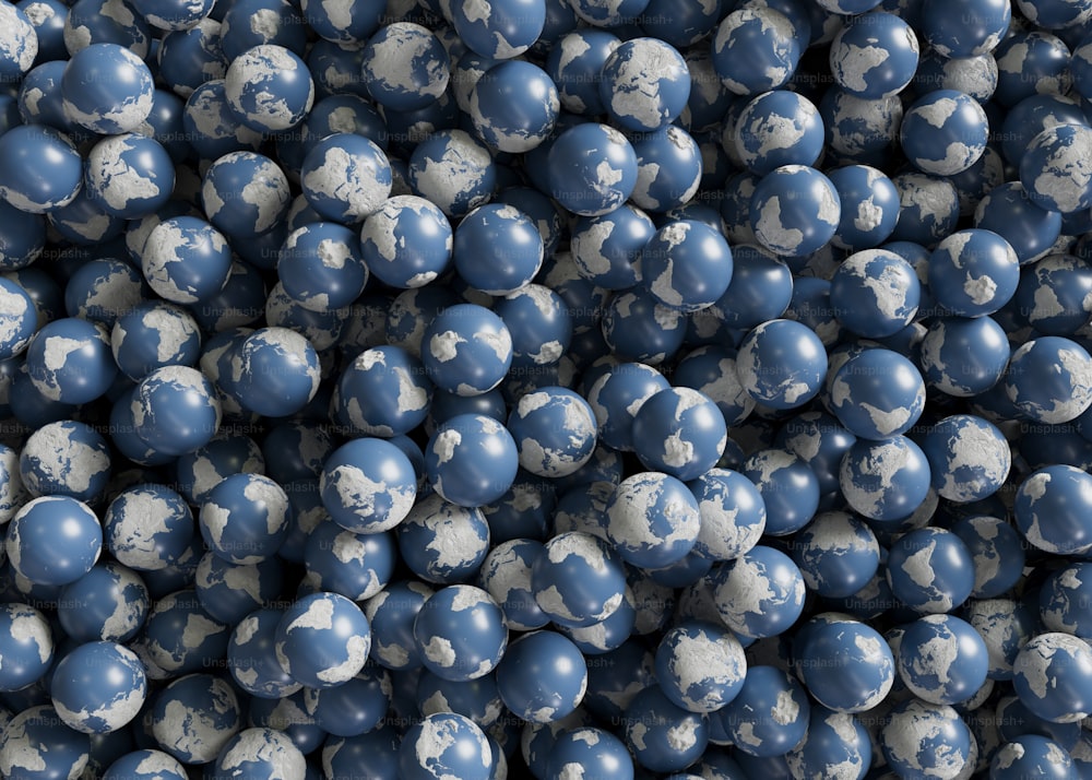 a large pile of blue and white balls