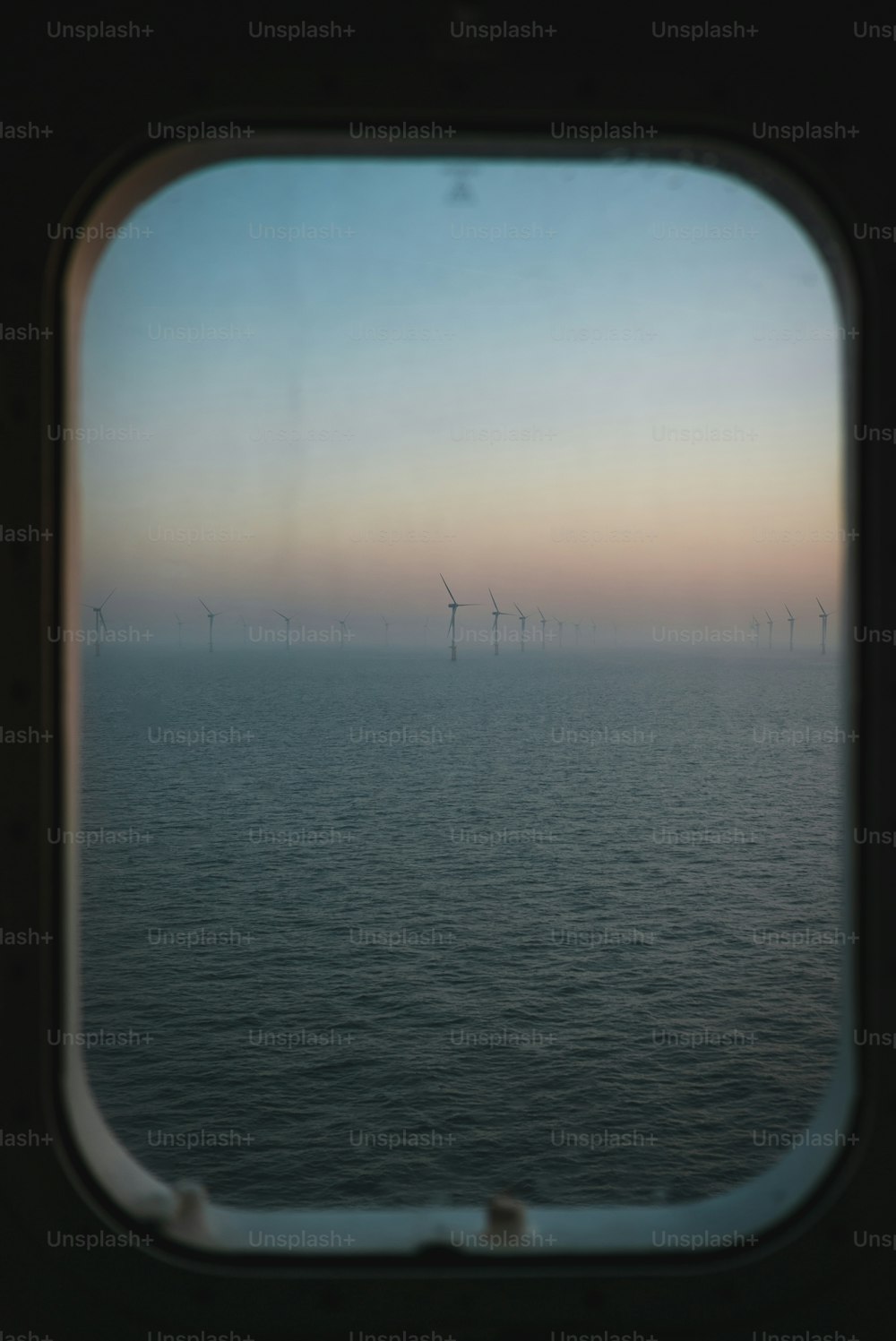 a view of the ocean through a window