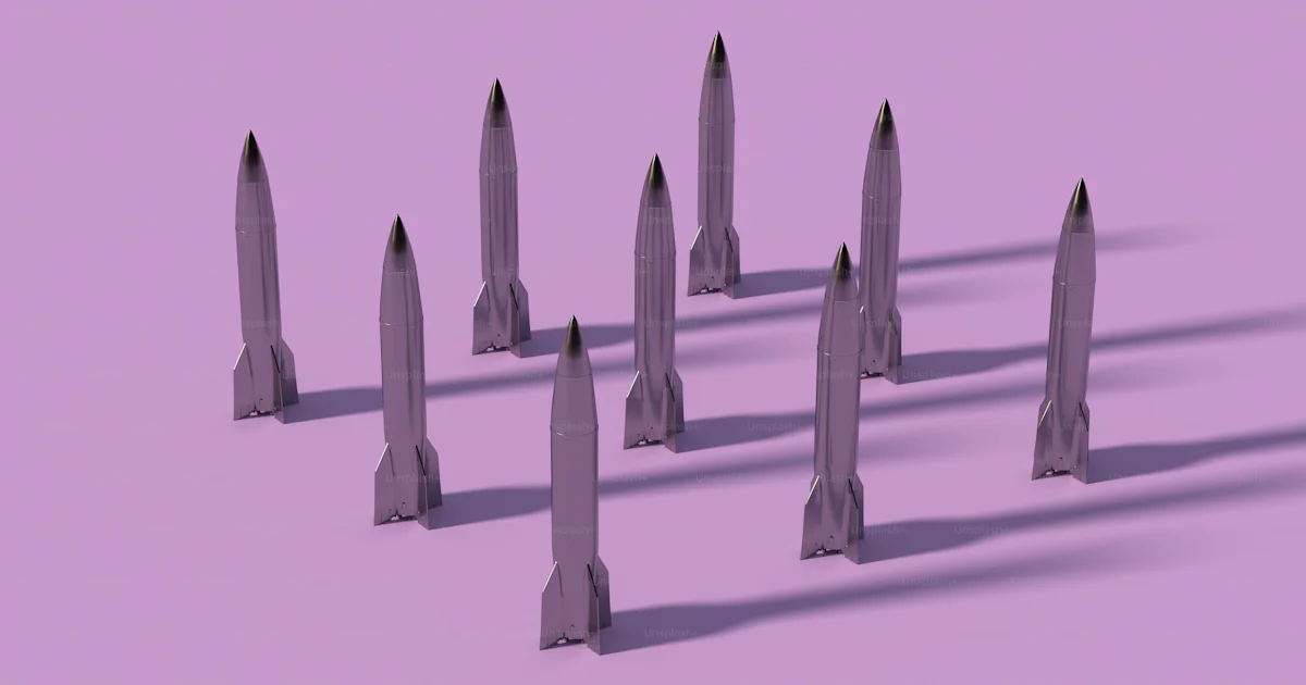 A group of pointed objects on a purple background photo – Technology ...
