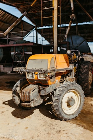 a yellow tractor parked in front of a building