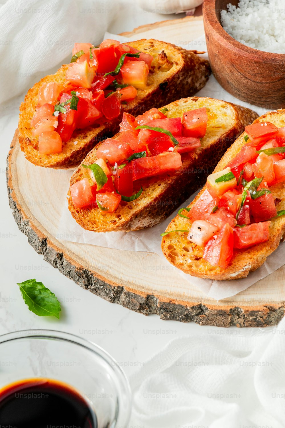a close up of a piece of bread with tomatoes on it