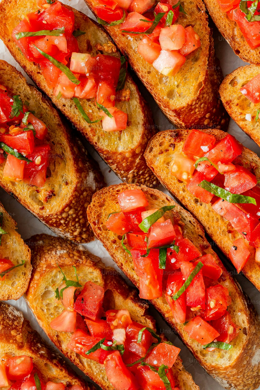 a close up of bread with tomatoes on it