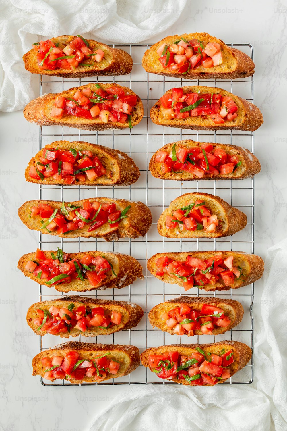 a bunch of breads that are on a rack