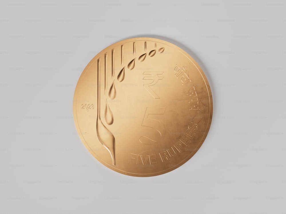 a close up of a gold medal on a white background