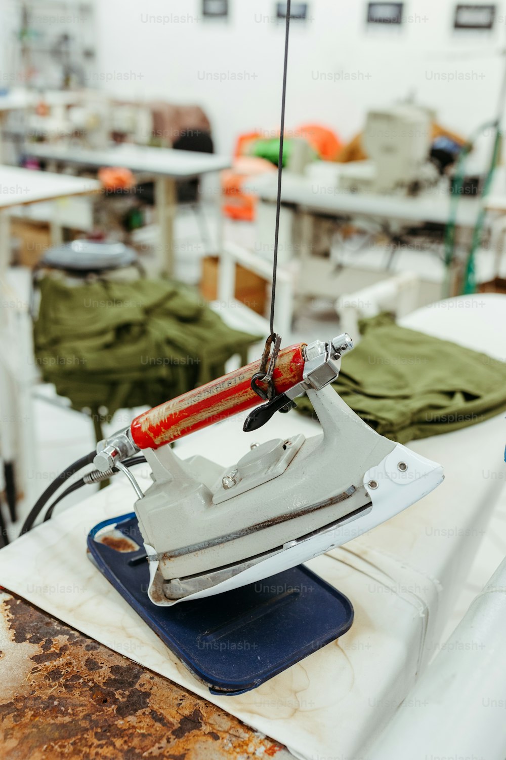 a white ironing board sitting on top of a table