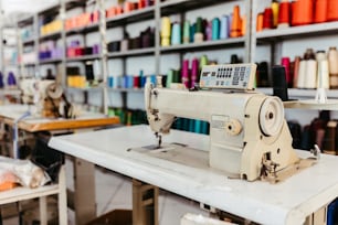 a sewing machine sitting on top of a white table