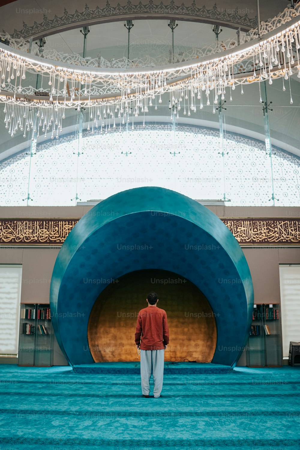 a man standing in front of a large blue object