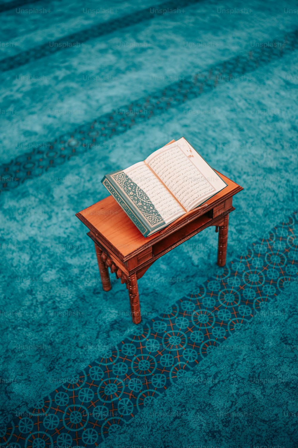 a wooden table with a book on top of it