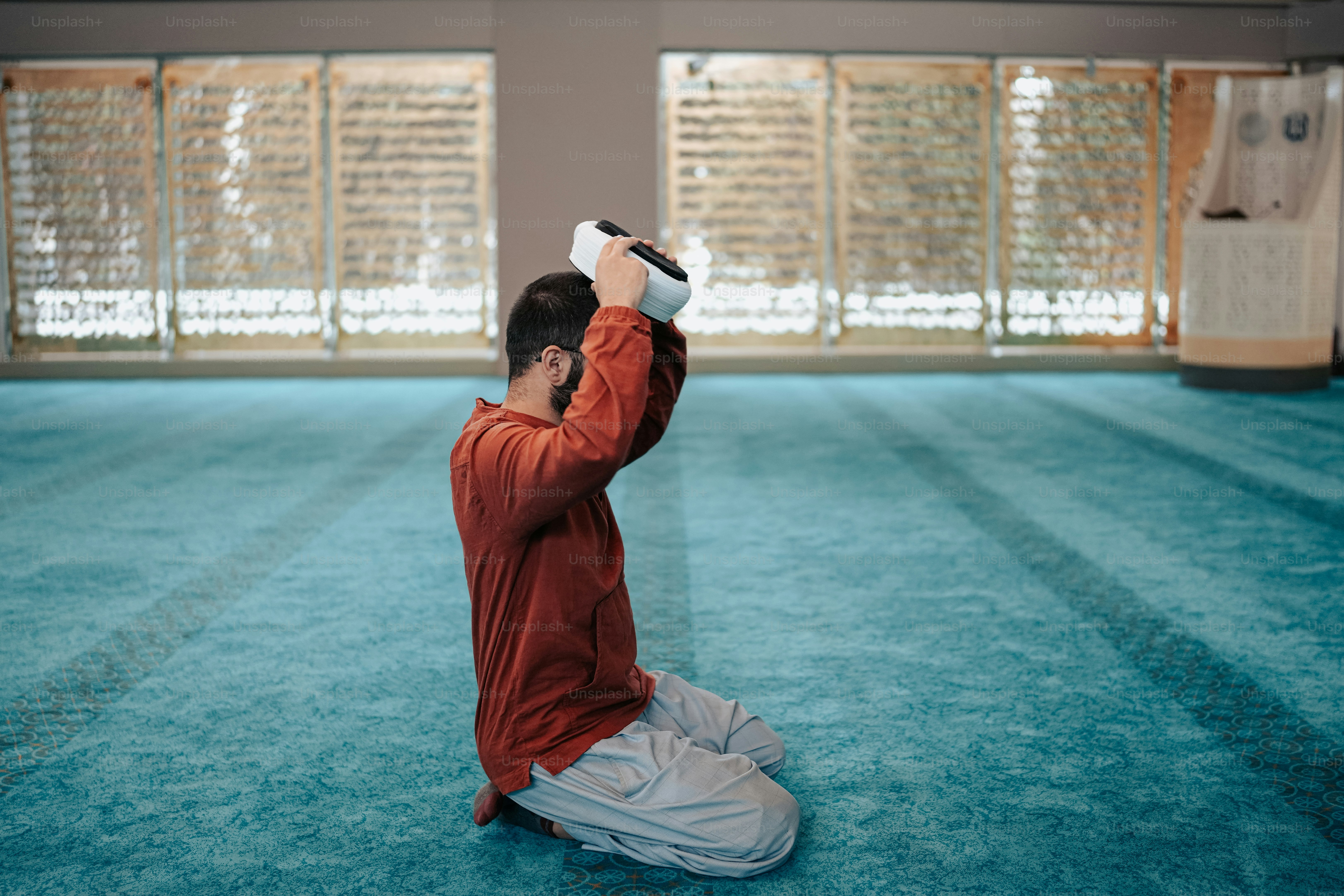 a man sitting on the floor taking a picture