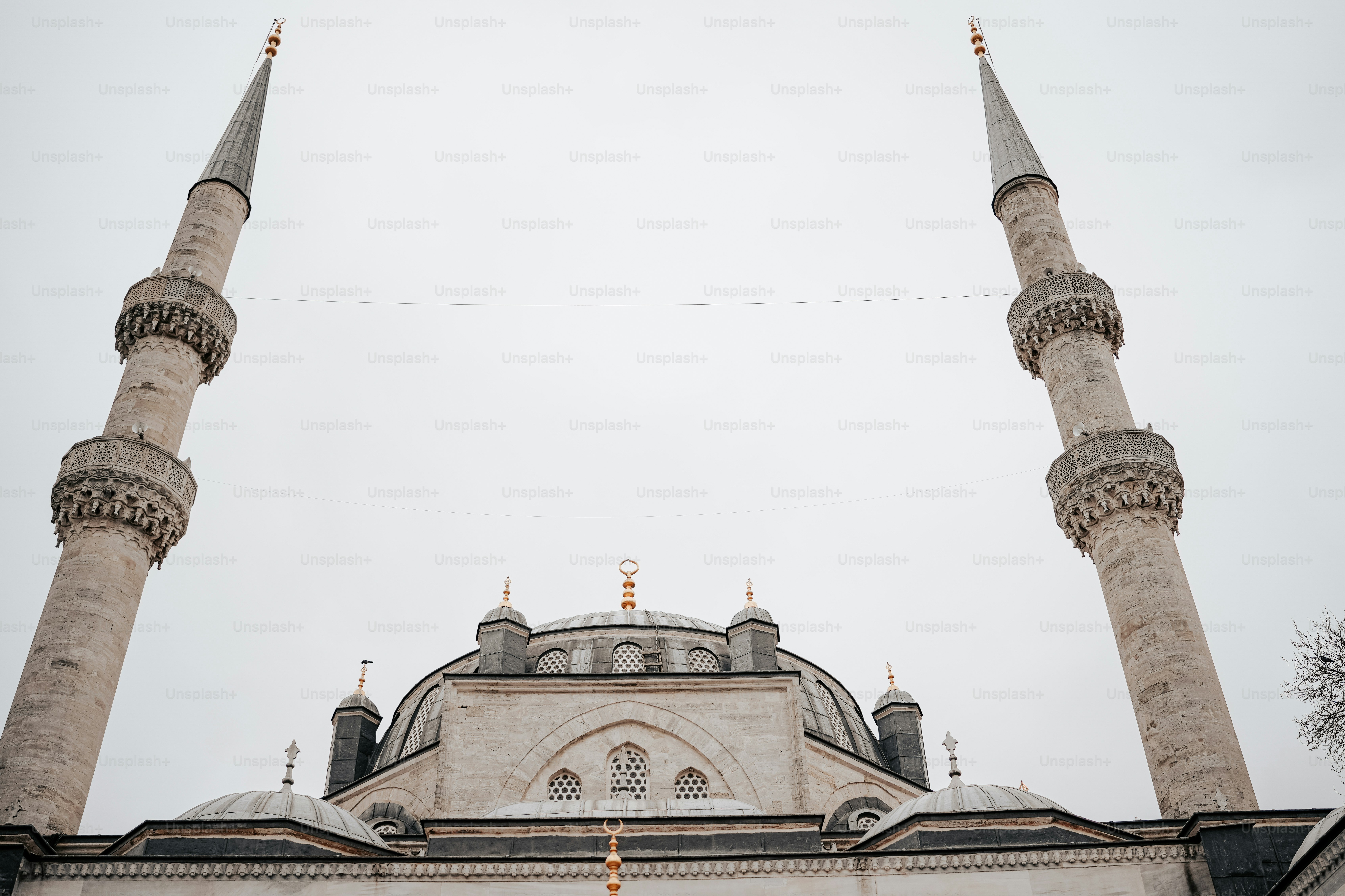 a large white building with two tall towers