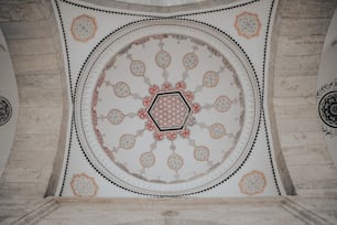 the ceiling of a building with a circular design