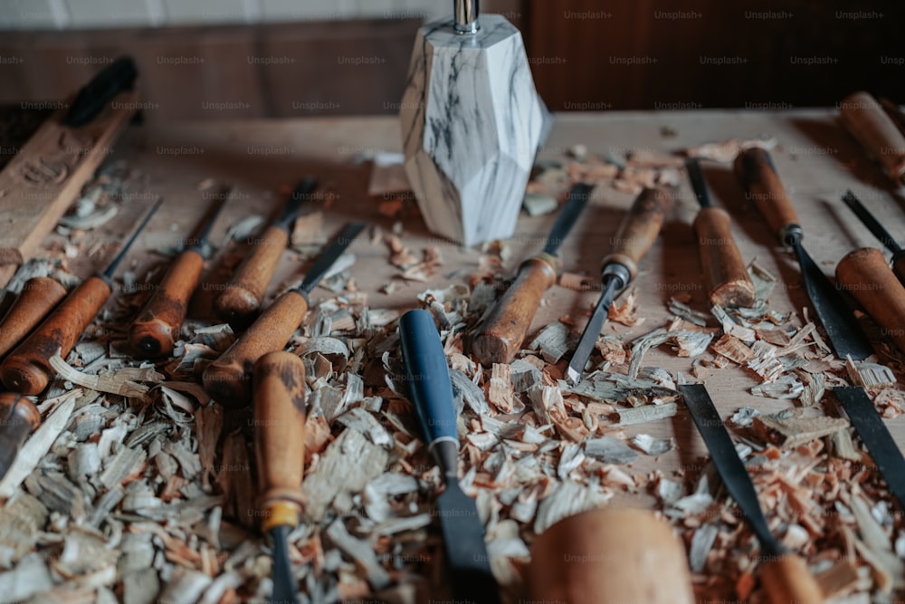 a table topped with lots of different types of wood shavings