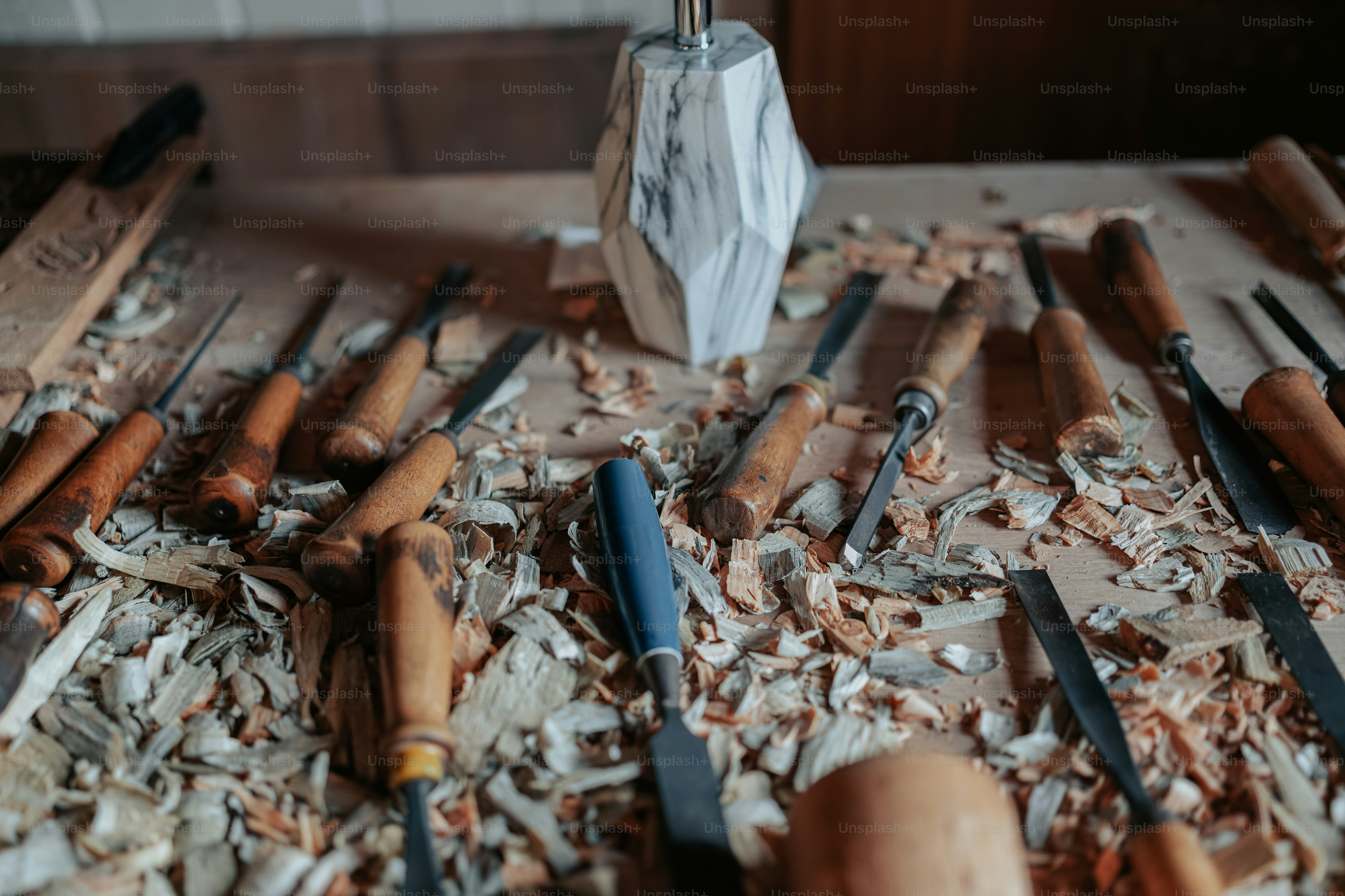 a table topped with lots of different types of wood shavings