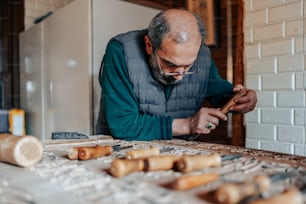 a man working on a piece of wood
