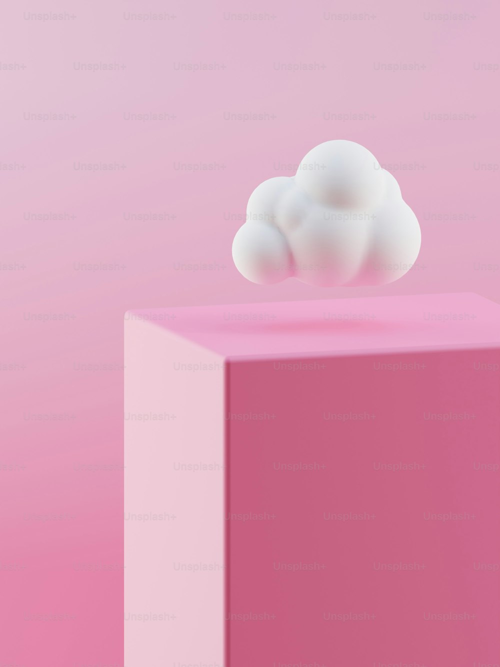 a pink box with a white cloud on top of it