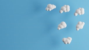 a group of white clouds on a blue background