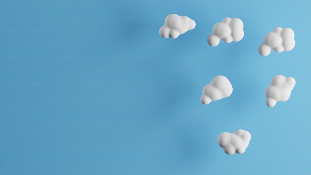 a group of white clouds on a blue background