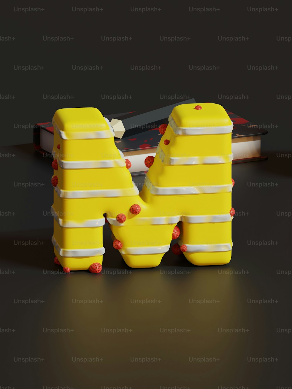 a pair of yellow letters sitting next to a skateboard