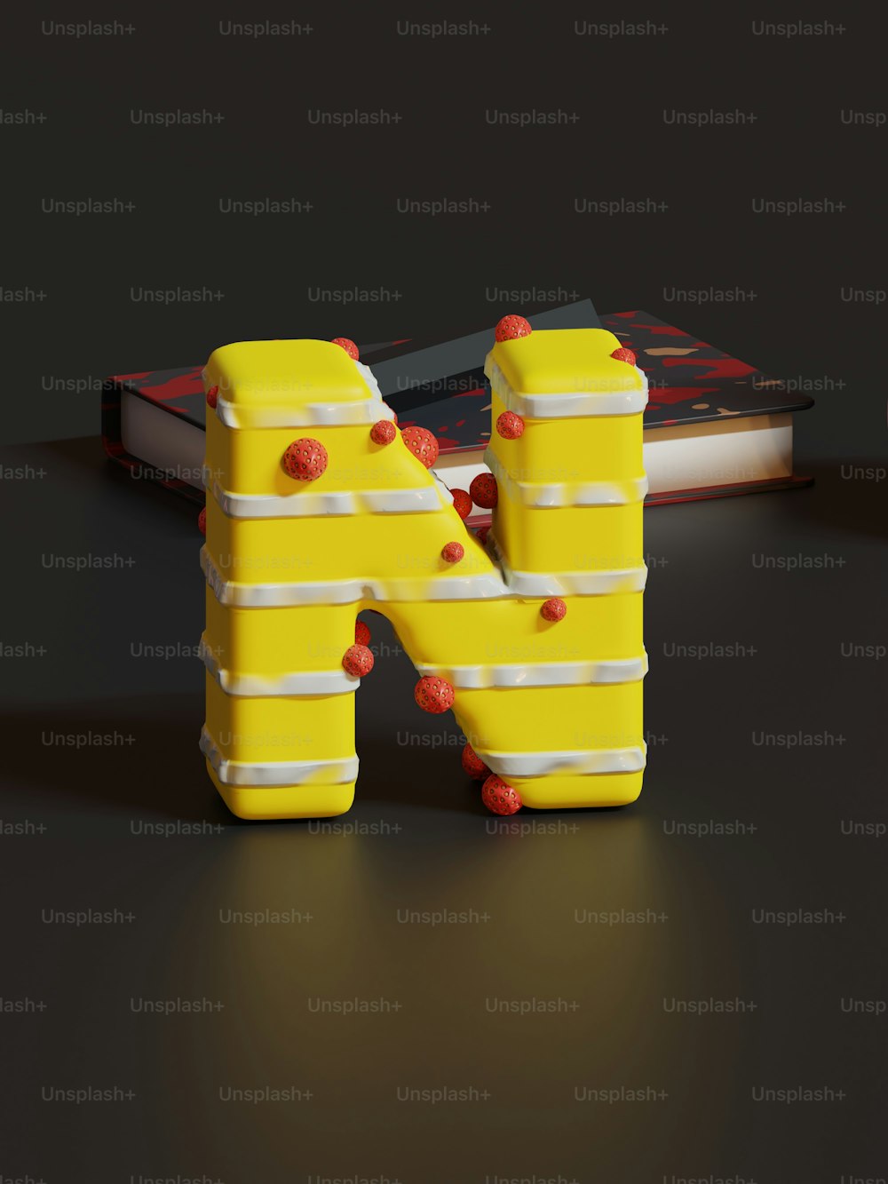 Ein gelb-weißer Buchstabe aus Legos