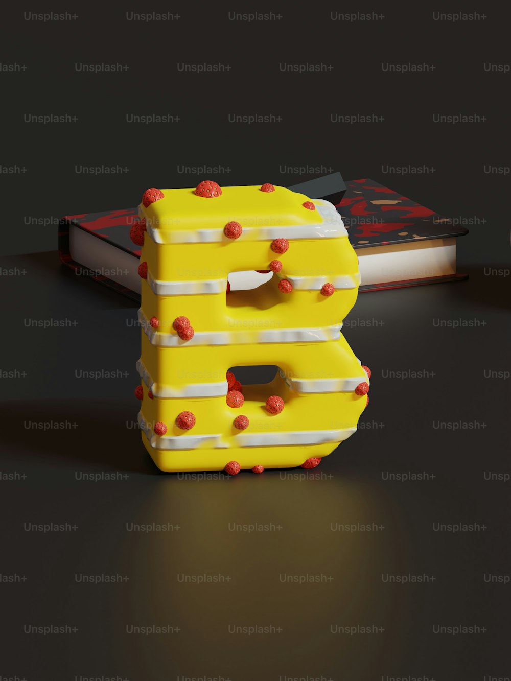 a yellow and white letter shaped object sitting on top of a table