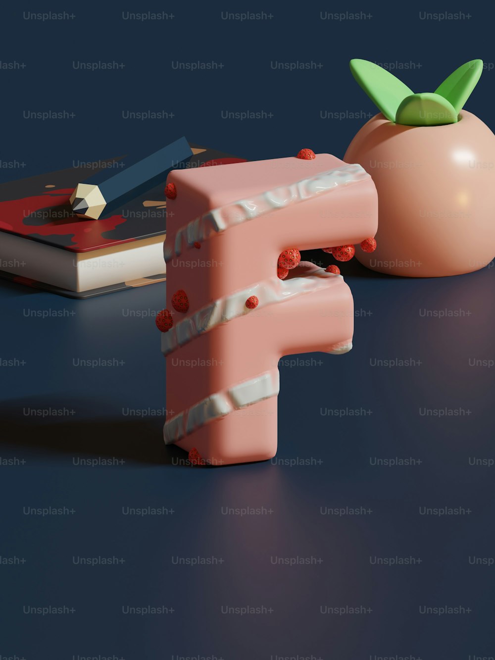 a pink object sitting next to a book on a table