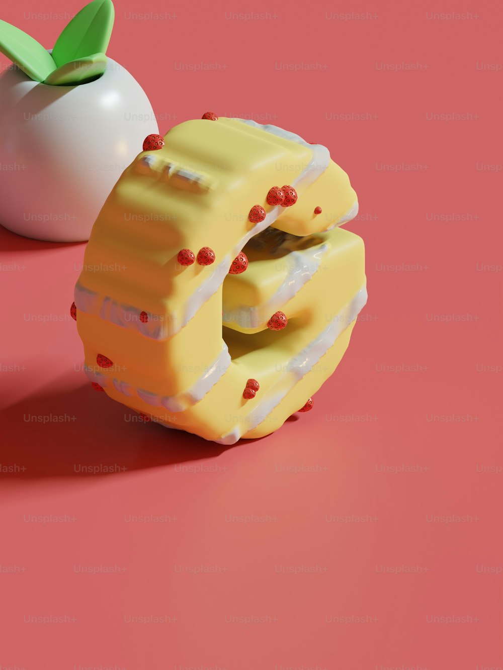um pedaço de bolo ao lado de uma maçã em uma superfície rosa