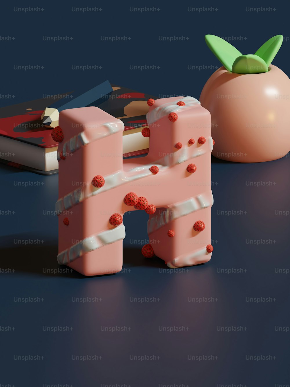 a pink object sitting next to a tomato on a table