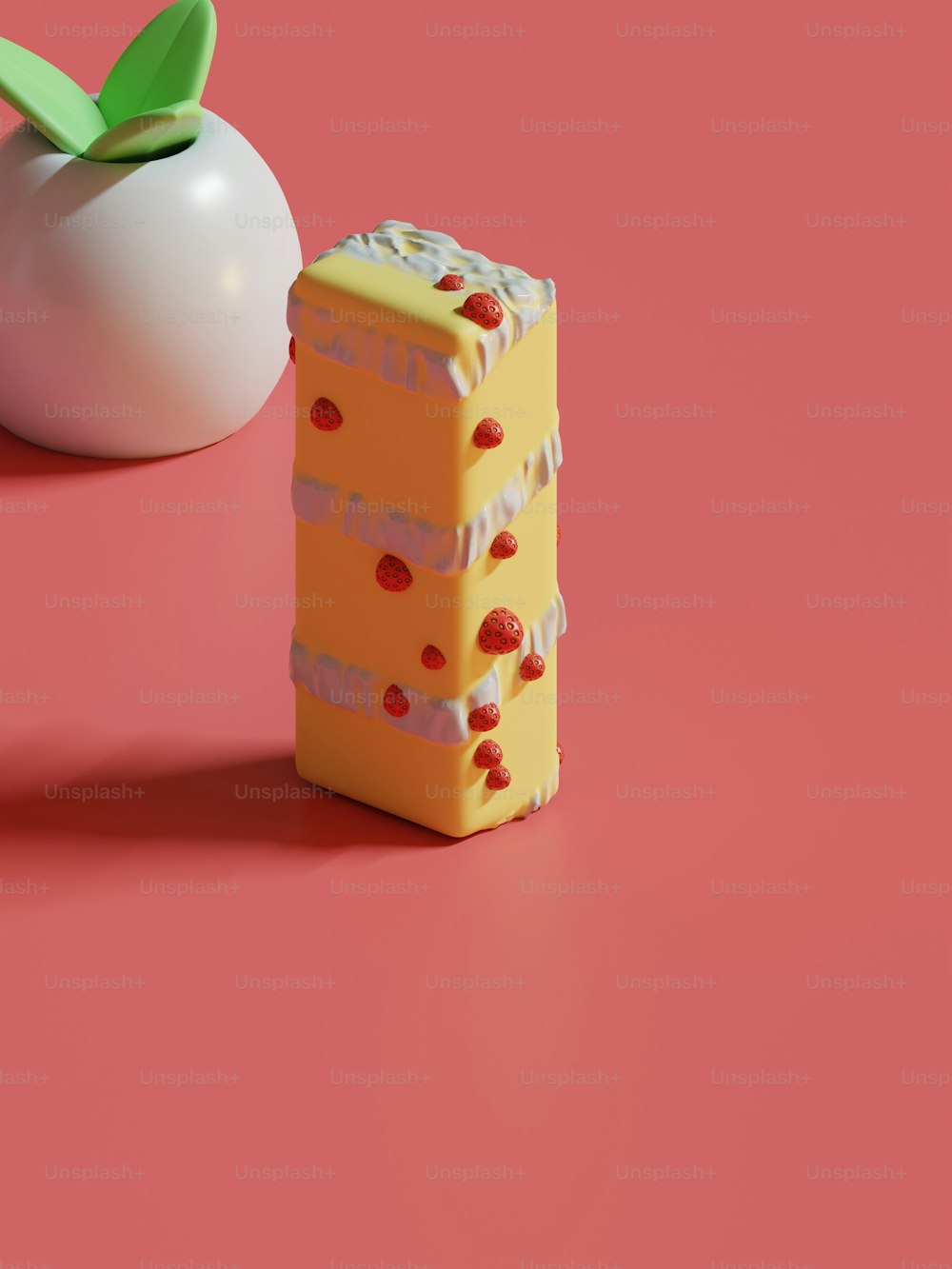 a piece of cake next to an apple on a pink surface