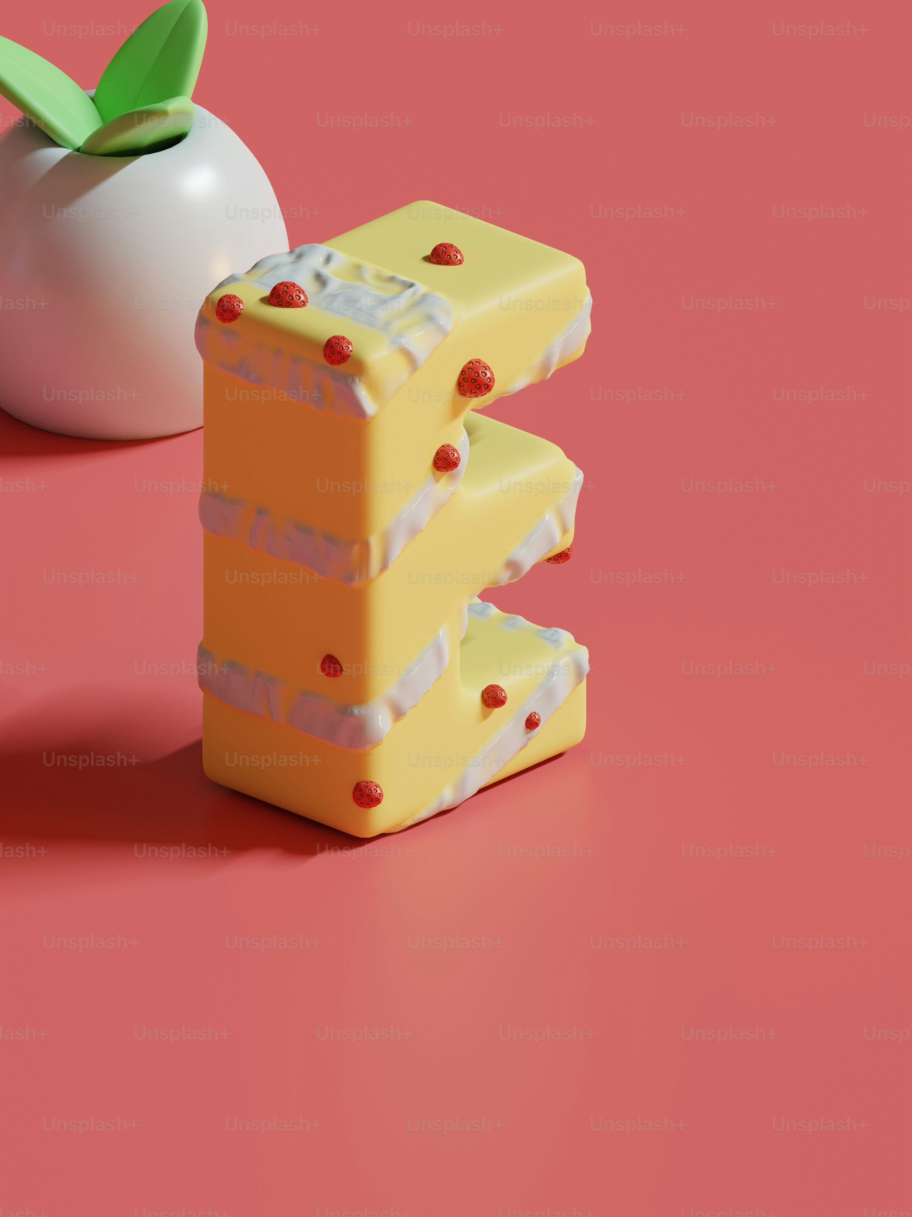 a piece of cake next to an apple on a pink surface