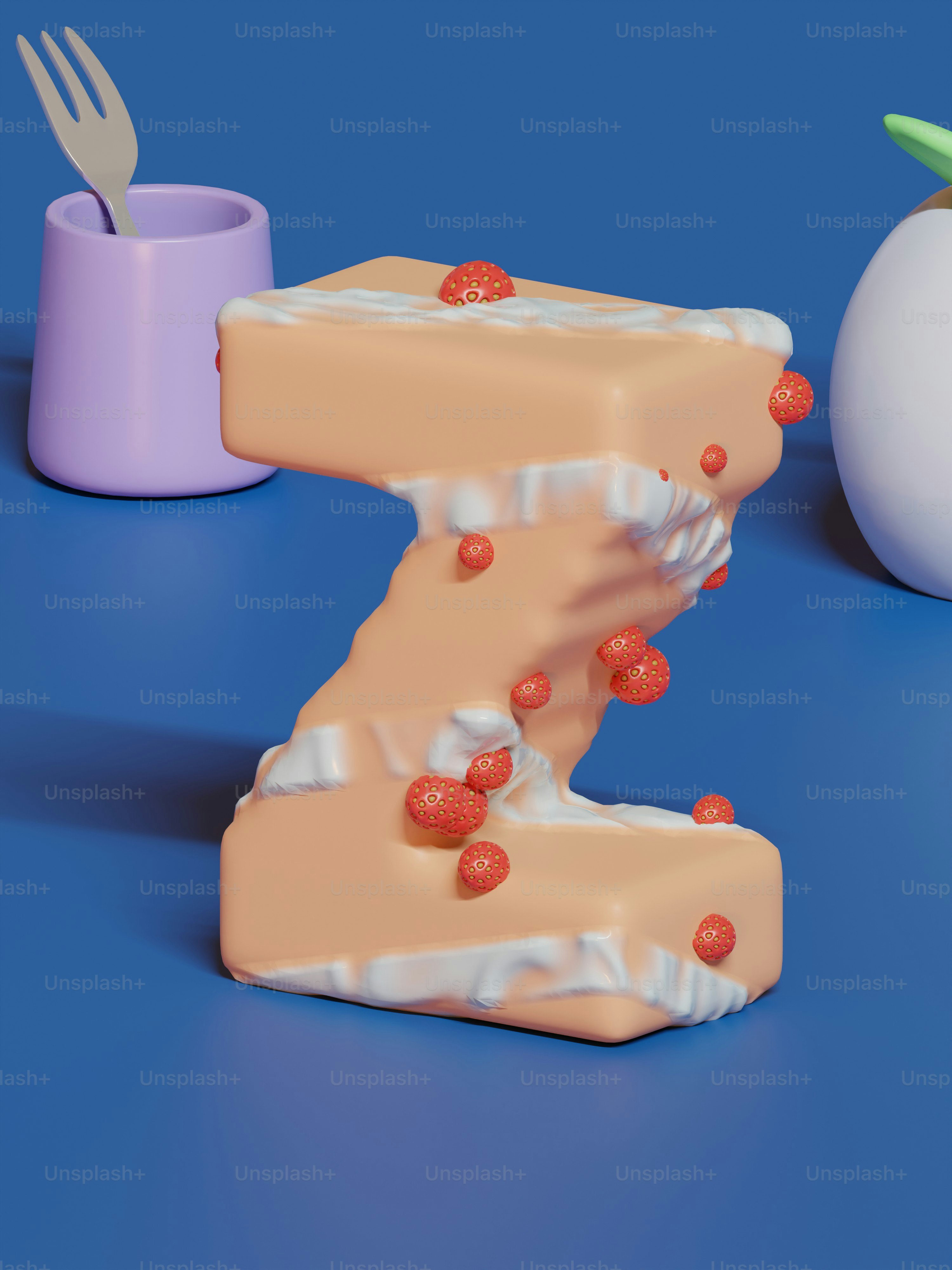 a cake shaped like the letter z next to an egg