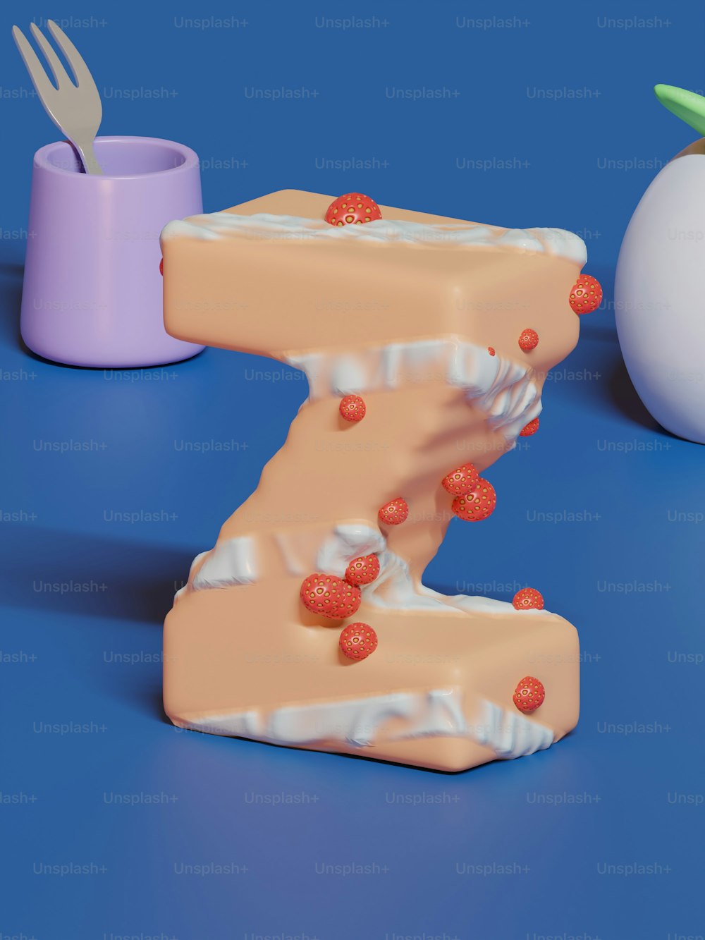 a cake shaped like the letter z next to an egg