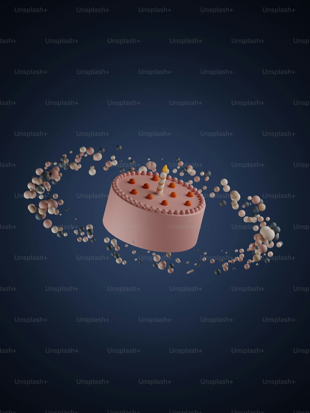 a small cake with a candle surrounded by small pebbles