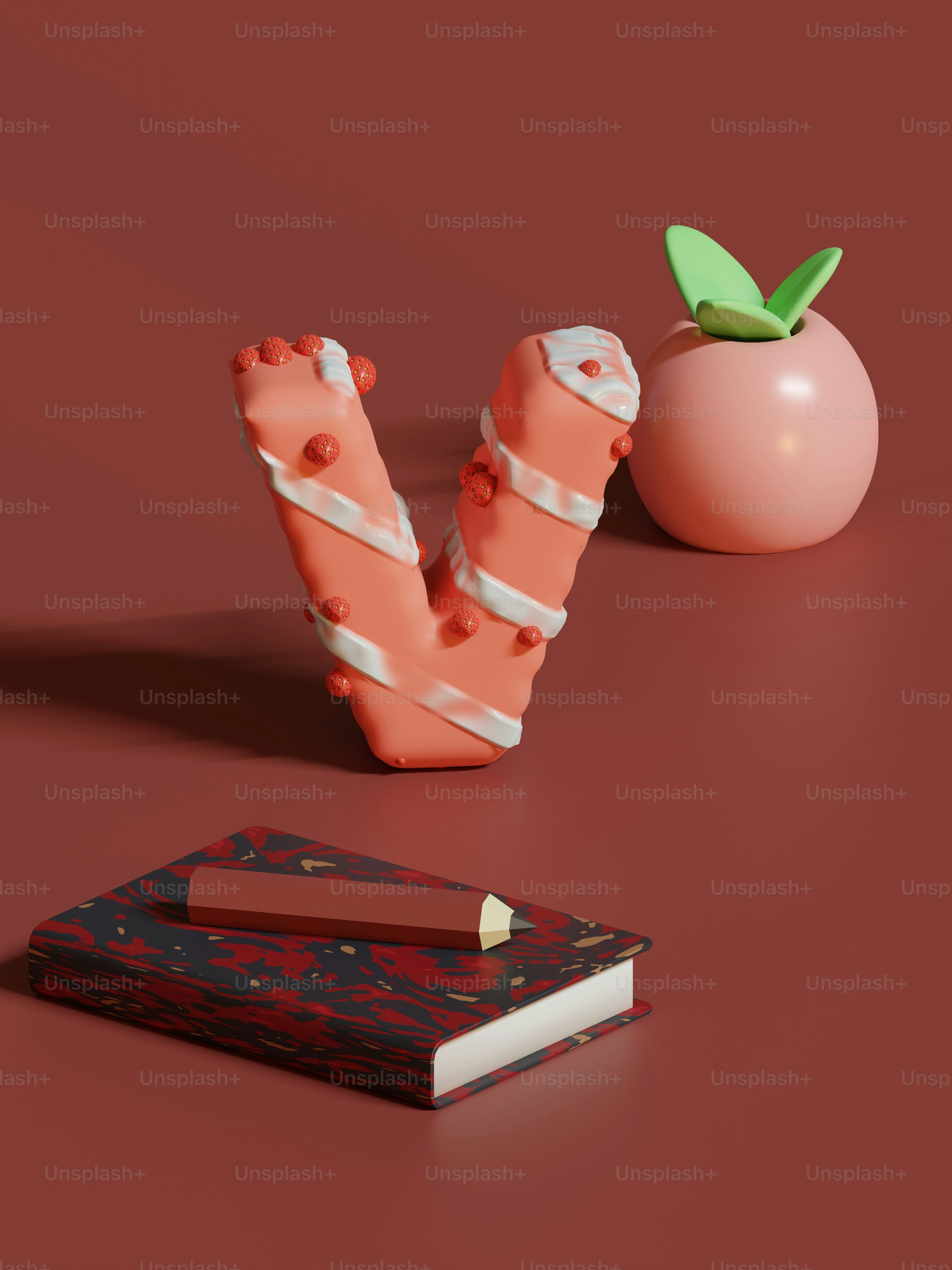 a book, a pencil, and an apple on a table
