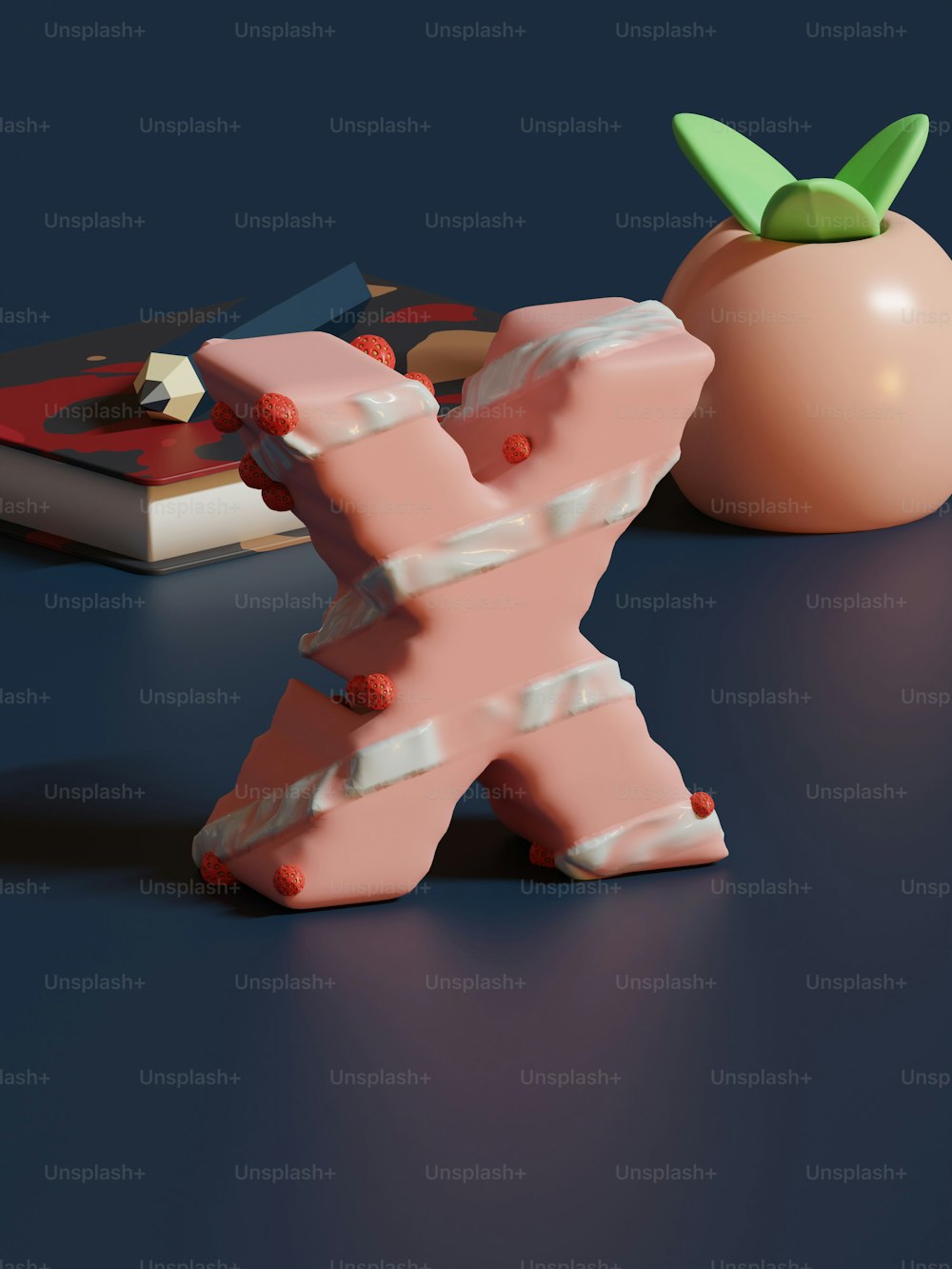 a 3d model of a letter x next to an apple