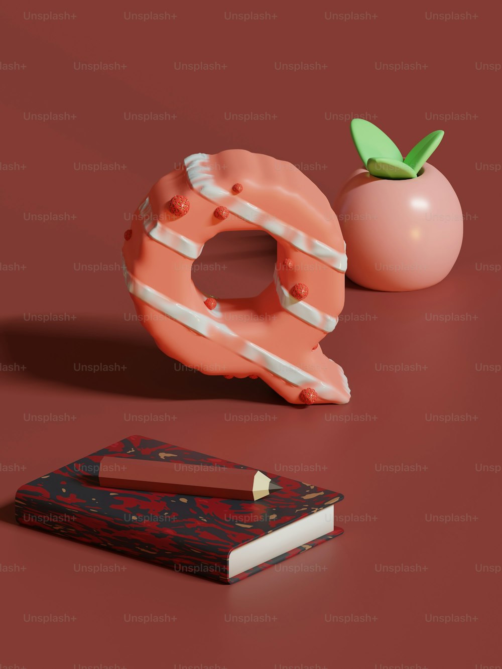 Ein Donut und ein Buch auf roter Fläche