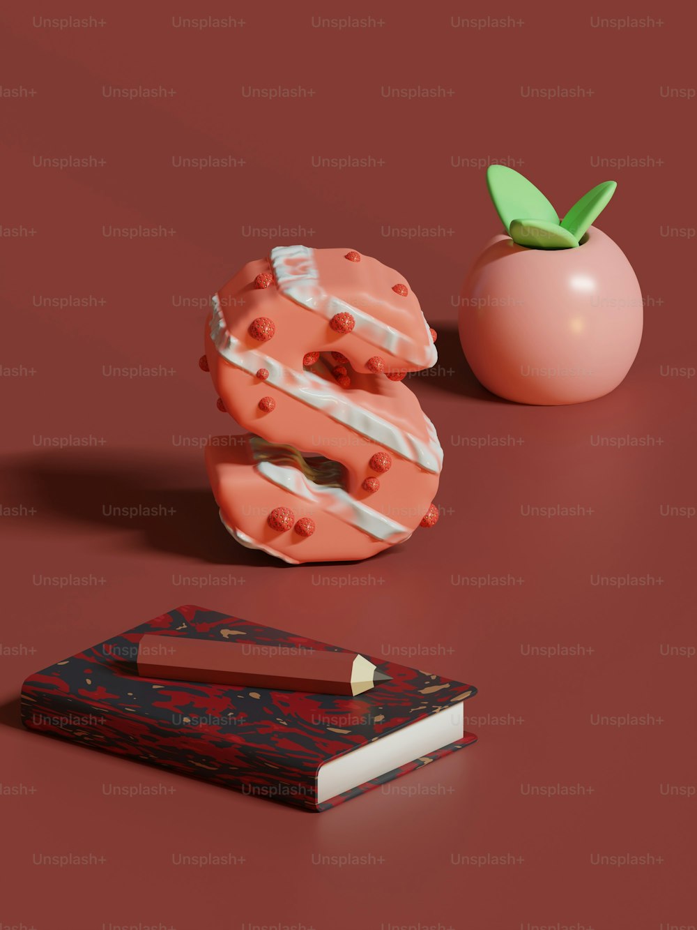 a donut with a bite taken out of it next to a book